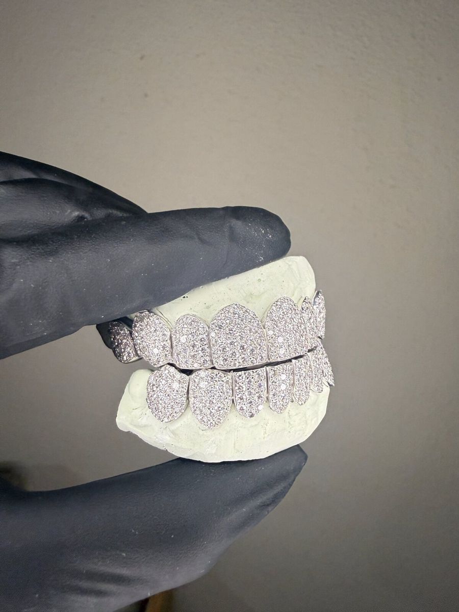 Flooded white gold grill, side view